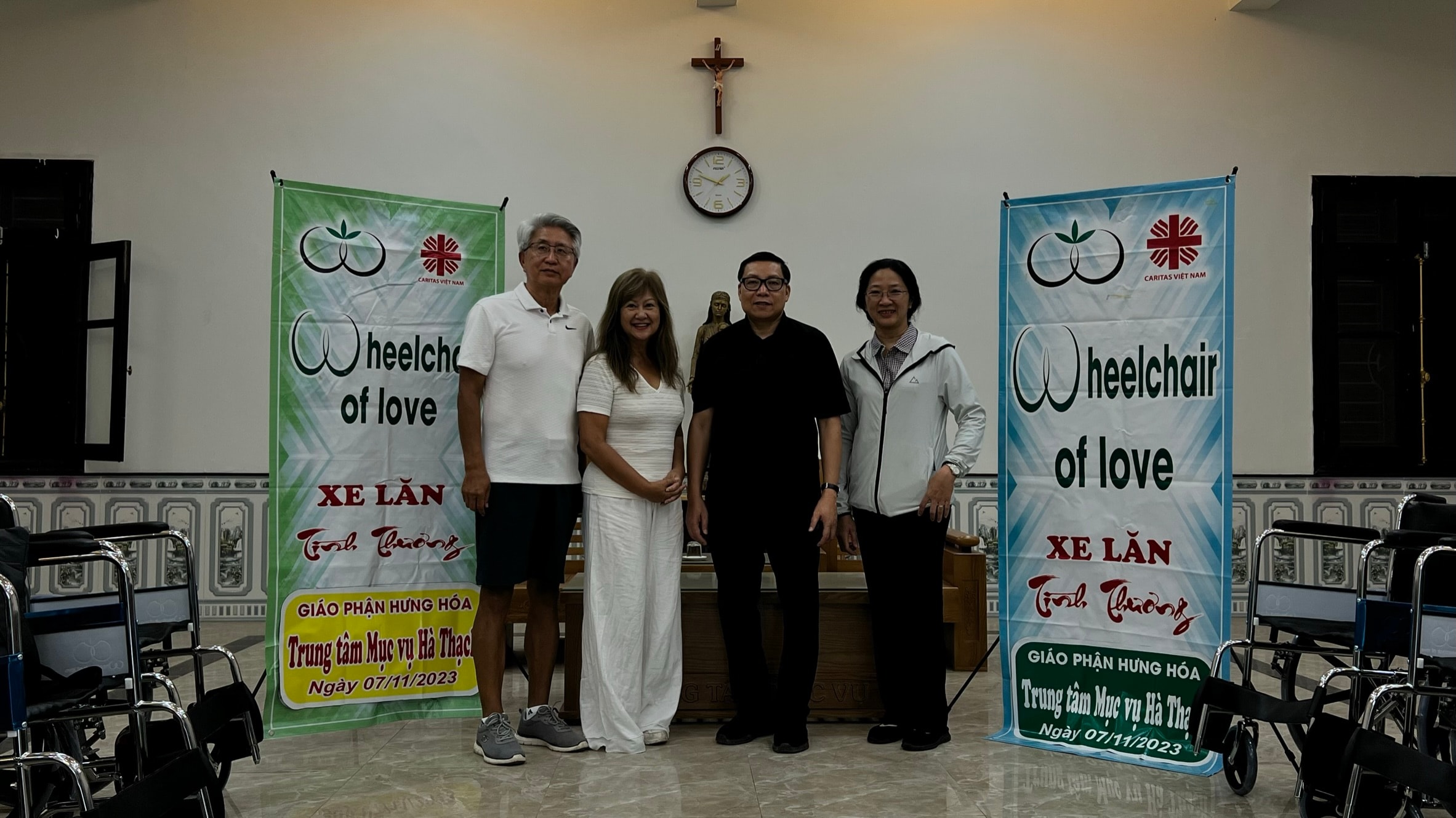 Wheelchairs Of Love — wheelchair donation event with banners