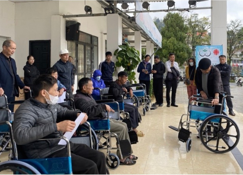 Wheelchairs Of Love — wheelchair distribution ceremony group photo